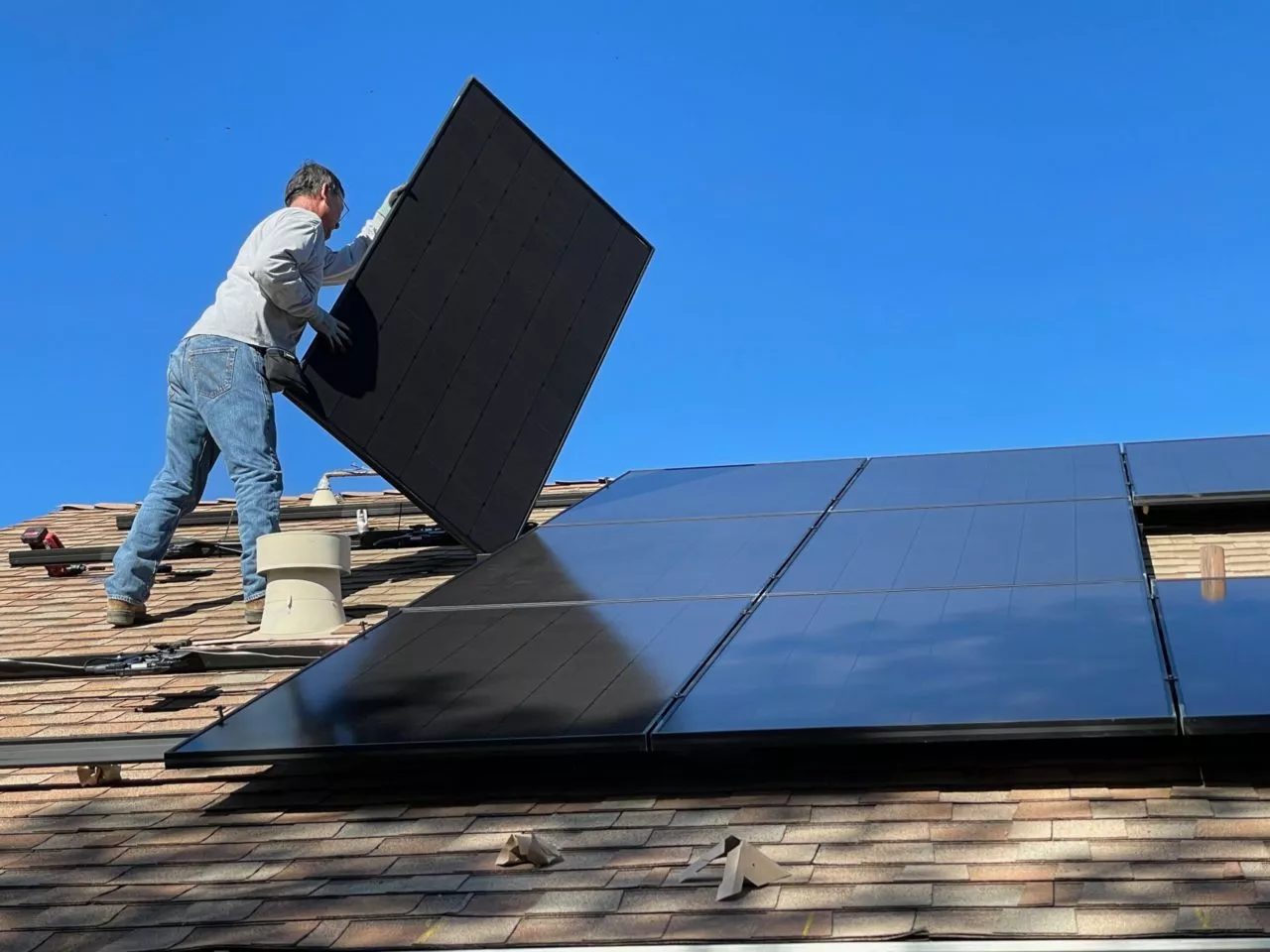 Solar panels installed on slanted roof.