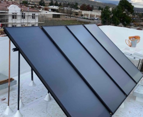 Solar panels installed on a flat roof.