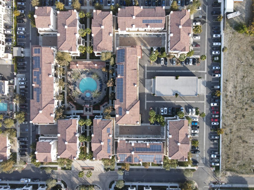 Aerial shot of several buildings with solar panels installed on top in Montclair