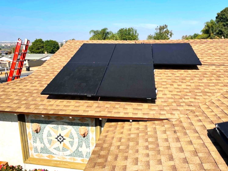 Five solar panels mounted on the roof of a home in Norco.