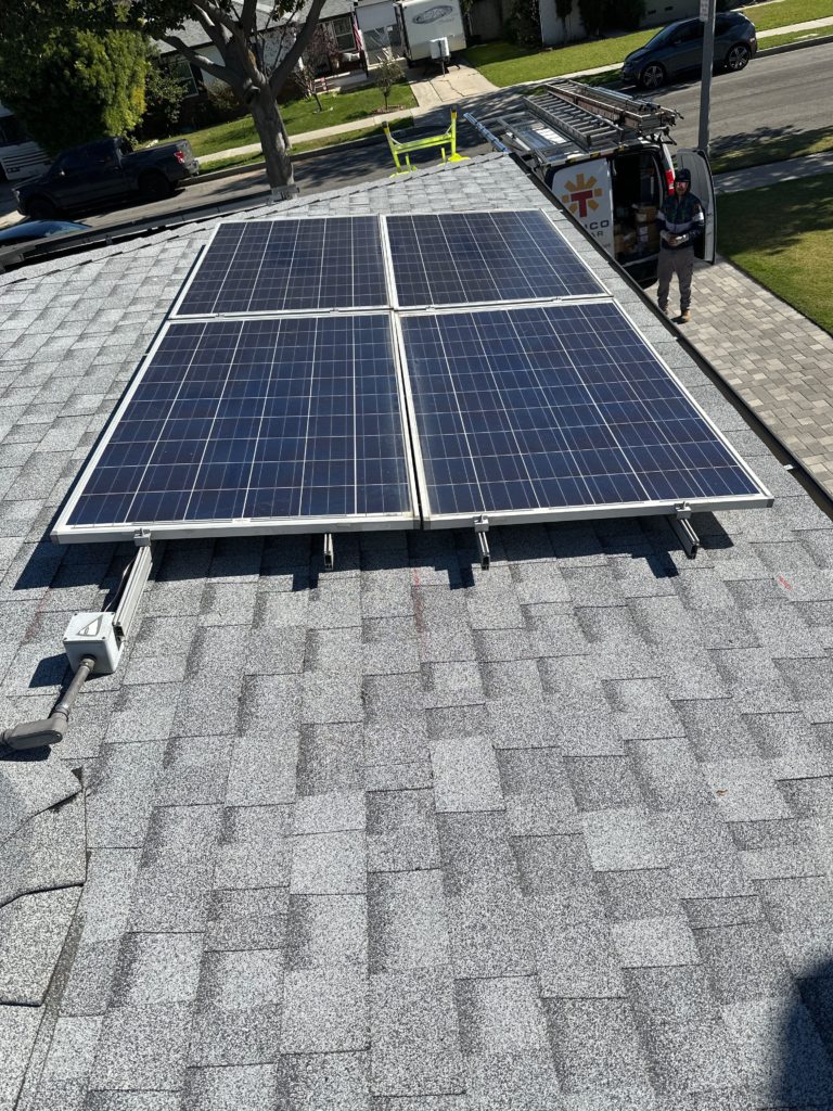 Solar panels installed on a home's gray roof.